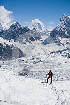 Trekker is walking by Renjo La pass in Everest region