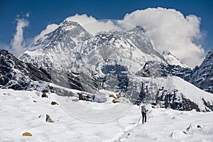 Trekker is walking by Renjo La pass in Everest region