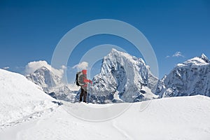 Trekker is walking by Renjo La pass in Everest region