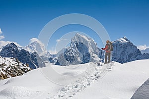 Trekker is walking by Renjo La pass in Everest region