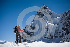 Trekker is walking by Renjo La pass in Everest region