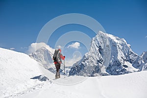 Trekker is walking by Renjo La pass in Everest region