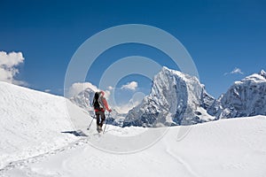 Trekker is walking by Renjo La pass in Everest region