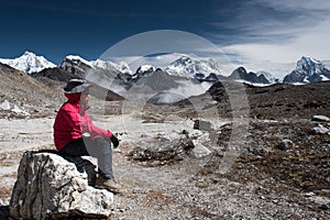 Trekker on the way from Lobuche to Gokyo village with Naktok lake and mountain in everest base camp trek route region