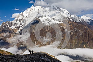 Trekker on the way to the valley covered with cloud on Manaslu c