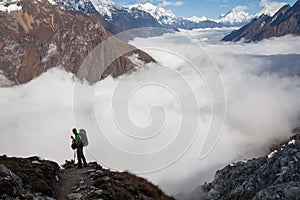 Trekker on the way to the valley covered with cloud on Manaslu c