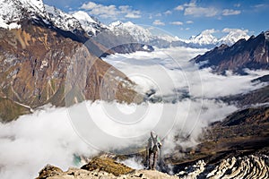 Trekker on the way to the valley covered with cloud on Manaslu c