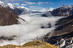 Trekker on the way to the valley covered with cloud on Manaslu c