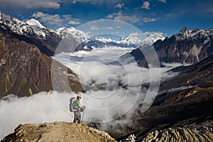 Trekker on the way to the valley covered with cloud on Manaslu c