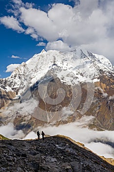 Trekker on the way to the valley covered with cloud on Manaslu c