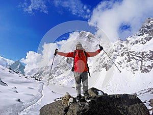 Trekker winner on the top, Himalaya mountains, man trekker after trek to Everest Base camp