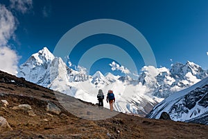 Trekkers approaching Amadablan mount in Khumbu valley on a way t