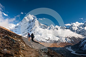 Trekkers approaching Amadablan mount in Khumbu valley on a way t