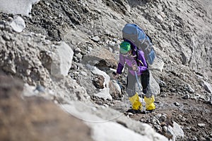 Trekkers crossing Gokyo glacier in Khumbu valley on a way to Eve