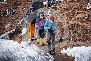 Trekkers crossing Gokyo glacier in Khumbu valley on a way to Eve