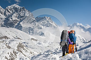 Trekkers crossing Gokyo glacier in Khumbu valley on a way to Eve