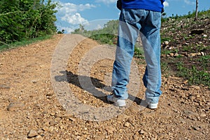 Trekking adventure Walk along the Gravel Dirt road /mountain road/country road in Forest.