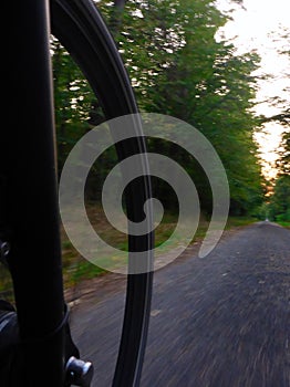 Trekking bicycle wheel on way in motion