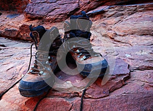 Trekking boots on red rocks