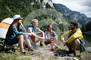 Trekking, camping, hiking and wild life concept. Group of friends are hiking in nature
