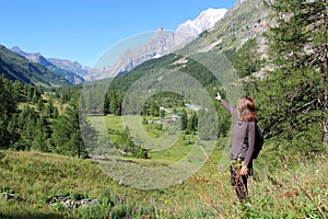 Trekking girl on mountain trail in Ferret Valley