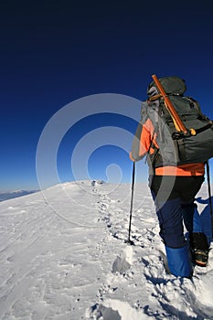 Trekking man in winter