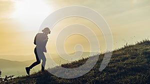 Trekking In Mountains. Tourist With Backpack Goes Up Mountain Road