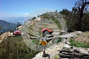 Trekking in Nepal Himalayas. Male tourist hiking near Dakachu village