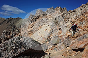 Trekking in Patagonia deserted mountains, Nahuel Huapi National Park, Man hiking on Cerro Catedral mountain steep