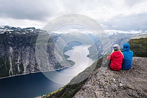Trekking to Trolltunga cliff with view on Ringedalsvatnet lake,