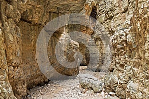 Trekking on a winding path through Imbros gorge near Chora Sfakion, island of Crete