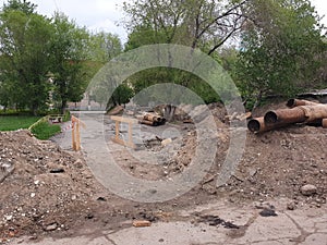 Trench with pipes, repair work on the water supply