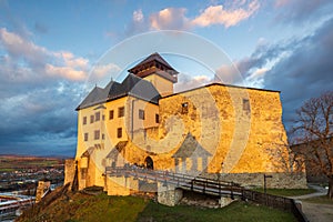 The Trencin Castle above the town of Trencin at sunset, Slovakia