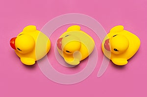 Trend Inflatable Children toy for swimming. Inflatable Three yellow chicken or duckling on pink background, pool float party. Flat