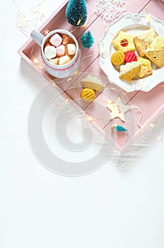 Cozy Christmas indoors tray of goodies with with copy space.