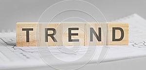 Trend word on wood cube blocks on gray background