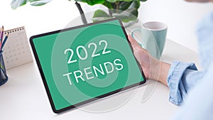 2022 trends on digital tablet  screen background, business plan and technology concept photo