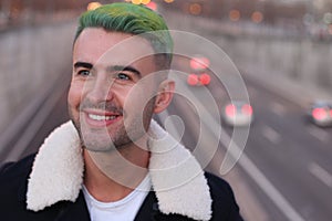 Trendsetter with green dyed hair smiling