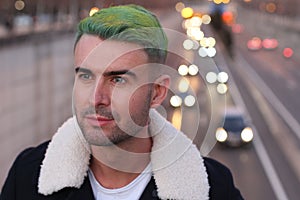 Trendsetter with green hair looking away
