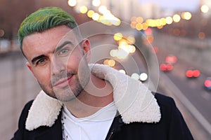 Trendsetter with green hair looking with confidence