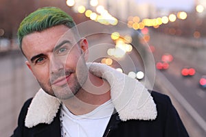 Trendsetter with green hair looking with confidence photo
