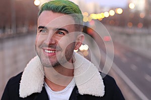 Trendsetter with green hair smiling