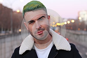 Trendsetter with green hair smiling photo
