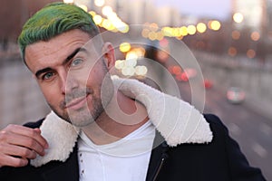 Trendsetter with green hair smiling