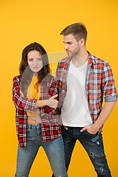 Trendsetters. Youth lead way in fashion ideas. Hipster couple students. Fashionable students couple yellow background photo
