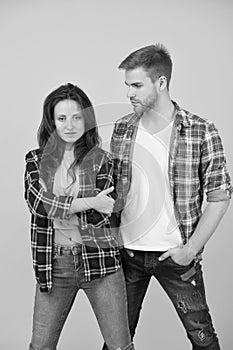 Trendsetters. Youth lead way in fashion ideas. Hipster couple students. Fashionable students couple yellow background photo