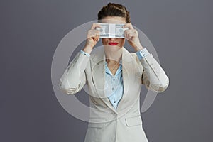 trendy 40 years old business woman showing see no evil gesture