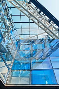 Trendy architecture with blue glass panels in a metal construction