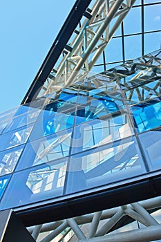 Trendy architecture with blue glass panels in a metal construction