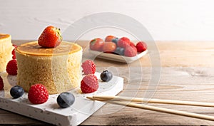 Trendy asian food, Fluffy homemade japanese souffle pancakes, hotcakes with raspberry, blackberry with copy space